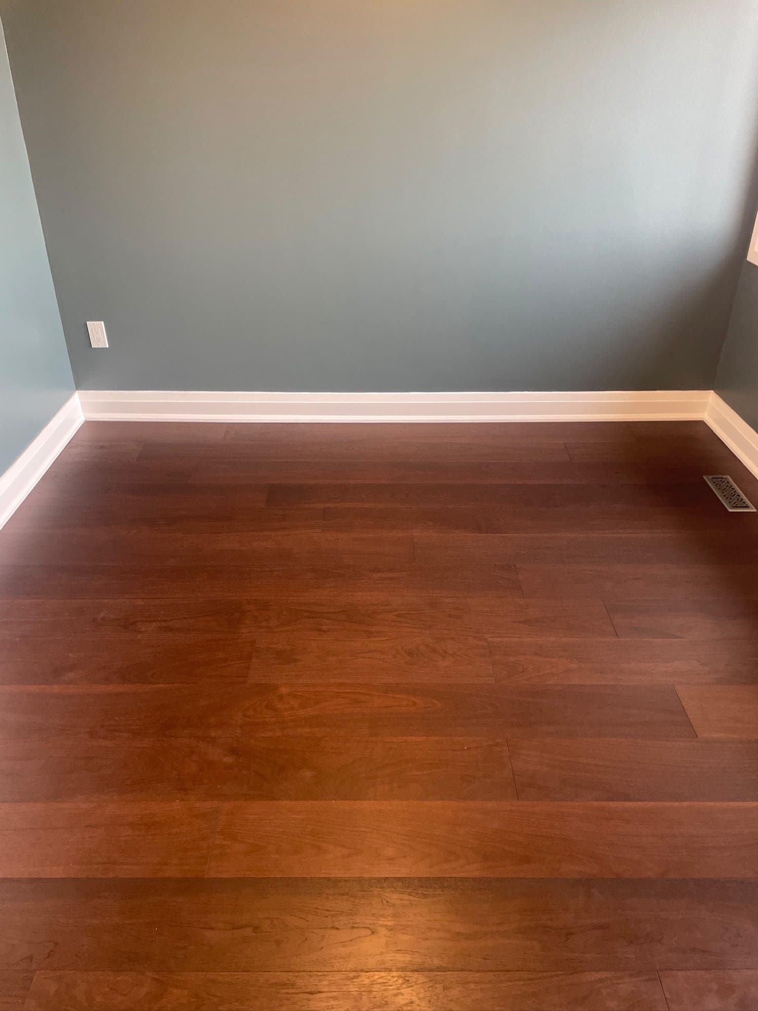 New hardwood flooring detail in a renovated bedroom