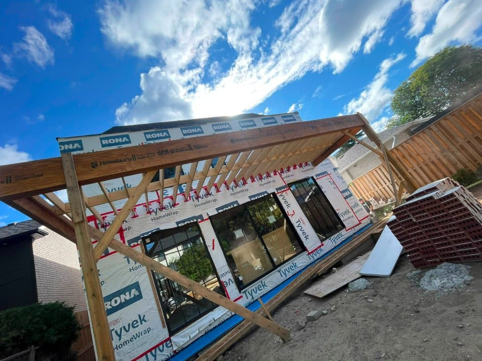 New addition framing with house wrap and window installation